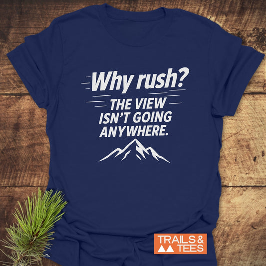Why Rush? Slow Hikers T-Shirt with mountain outline on navy fabric, highlighting outdoor adventure spirit. Includes pine sprig and TRAILS & TEES logo.