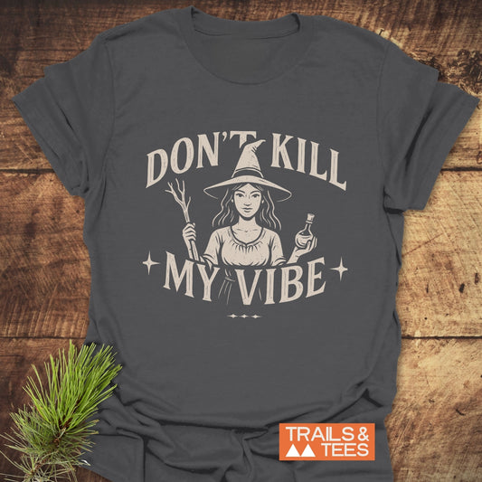 Don't Kill My Vibe Wood Witch T-Shirt featuring a witch graphic and slogan on soft, durable cotton, perfect for outdoor enthusiasts.