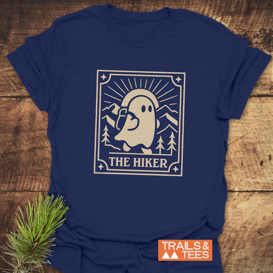 The Hiker Retro Tarot T-Shirt featuring a ghost with a backpack graphic; durable, pre-shrunk cotton for outdoor enthusiasts, by Trails & Tees.