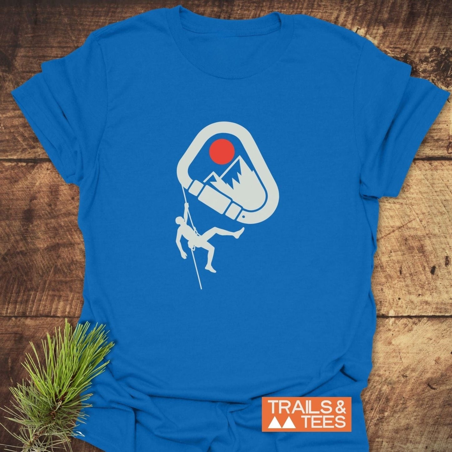 Bright blue 587 Mountain Climber Silhouette T-Shirt with a mountain and climber graphic, crafted from soft cotton for comfort and durability.