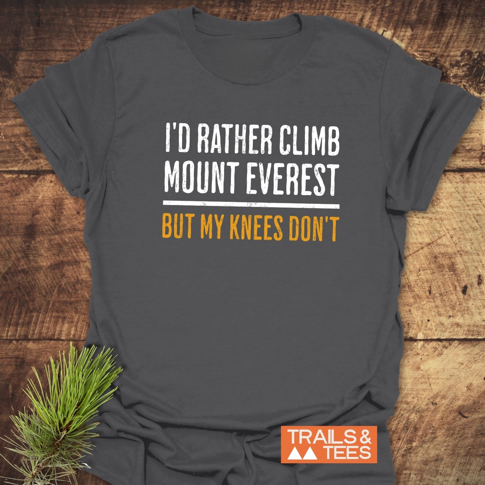 I'd Rather Climb Mt Everest T-Shirt, dark-gray, with humorous slogan in distressed font, featuring soft cotton, durable print, and small orange Trails & Tees logo.