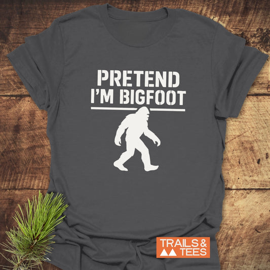 Pretend I'm Bigfoot T-Shirt featuring bold white text and Bigfoot silhouette, crafted from soft ring-spun cotton for comfort and durability, ideal for outdoor enthusiasts.