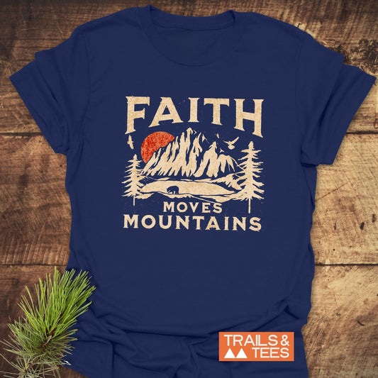 Faith Moves Mountains T-Shirt: Navy-blue tee with vintage mountain print, slogan, and Trails & Tees logo; crafted from soft, lightweight cotton for outdoor enthusiasts.