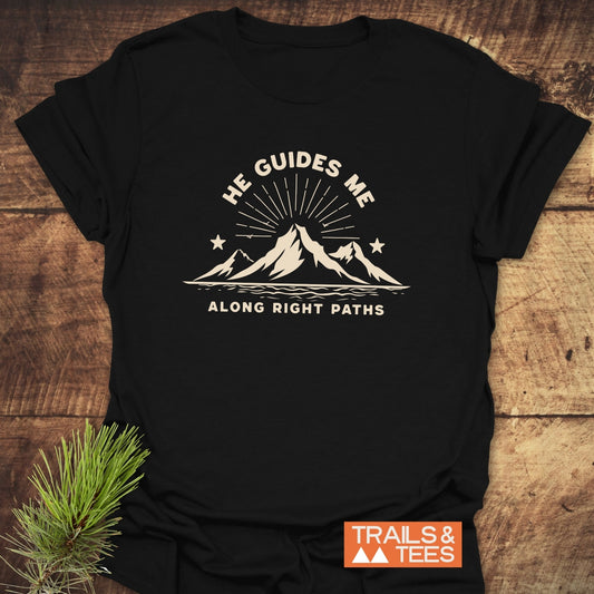 He Guides Me T-Shirt with mountain design, crafted from soft cotton. Features durable prints, taped shoulders, and pre-shrunk fit. Perfect for outdoor enthusiasts.