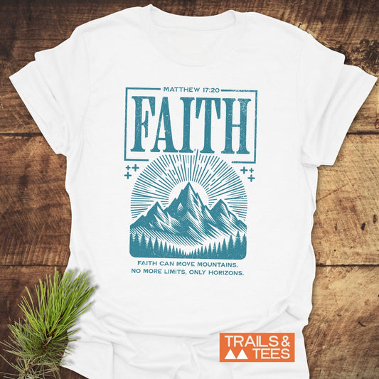 Faith Moves Mountains T-Shirt featuring a teal graphic with Matthew 17:20, mountain art, and No More Limits, Only Horizons motto, on white cotton.