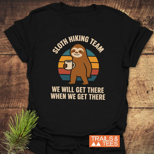 Sloth Hiking Team T-Shirt featuring a cartoon sloth with coffee on a retro backdrop. Made from soft cotton, pre-shrunk, durable print, and eco-friendly.