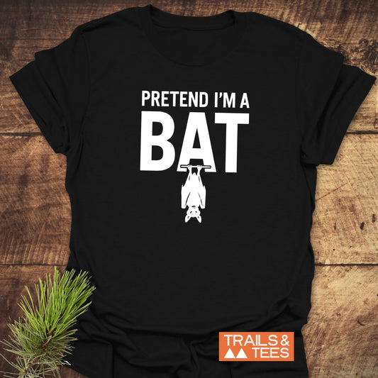 I'm A Bat T-Shirt on a wooden surface, features bold BAT text with hanging bat silhouette. Made from soft, durable cotton, ideal for outdoor adventures.