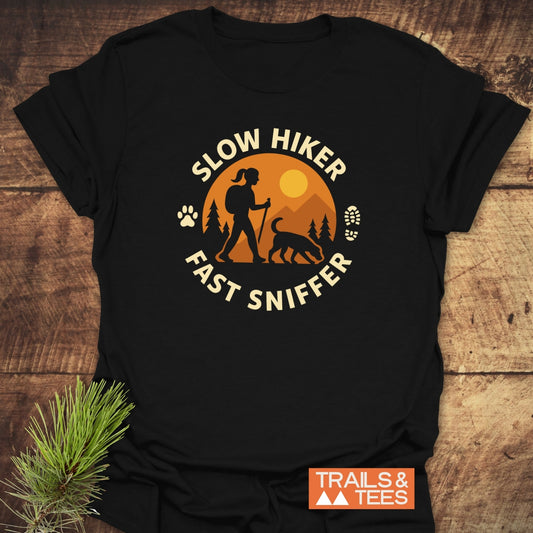Fast Sniffer T-Shirt featuring a hiking graphic with a backpacker and dog, crafted from soft cotton for comfort, pre-shrunk, durable print.
