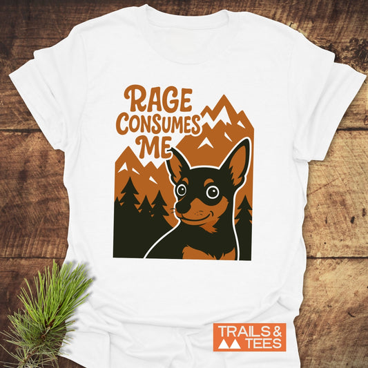 Rage Funny Dog T-Shirt features a black-and-tan dog with pine trees and mountains, slogan “RAGE CONSUMES ME.” Lightweight cotton, trail-ready comfort.