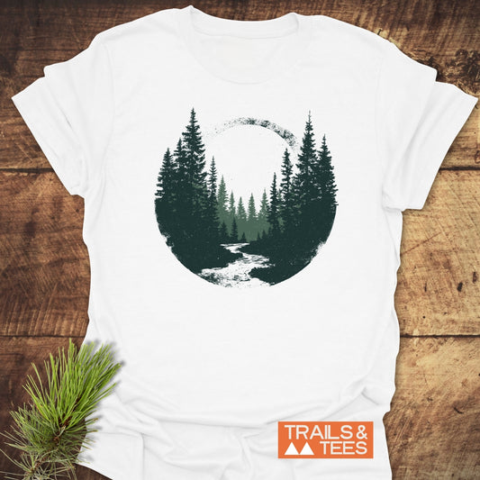 Woodland Peace T-Shirt with a forest scene graphic, crafted from soft ring-spun cotton, featuring durable prints and a small TRAILS & TEES logo.