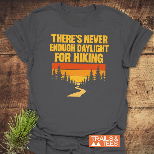 Never Enough T-Shirt with bold text and sunset graphics, designed for outdoor lovers. Made from soft cotton, featuring durable prints and eco-friendly production.