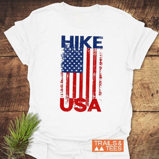 Hike USA T-Shirt featuring a distressed American flag graphic with HIKE and USA text, crafted from soft, lightweight cotton for outdoor adventures.