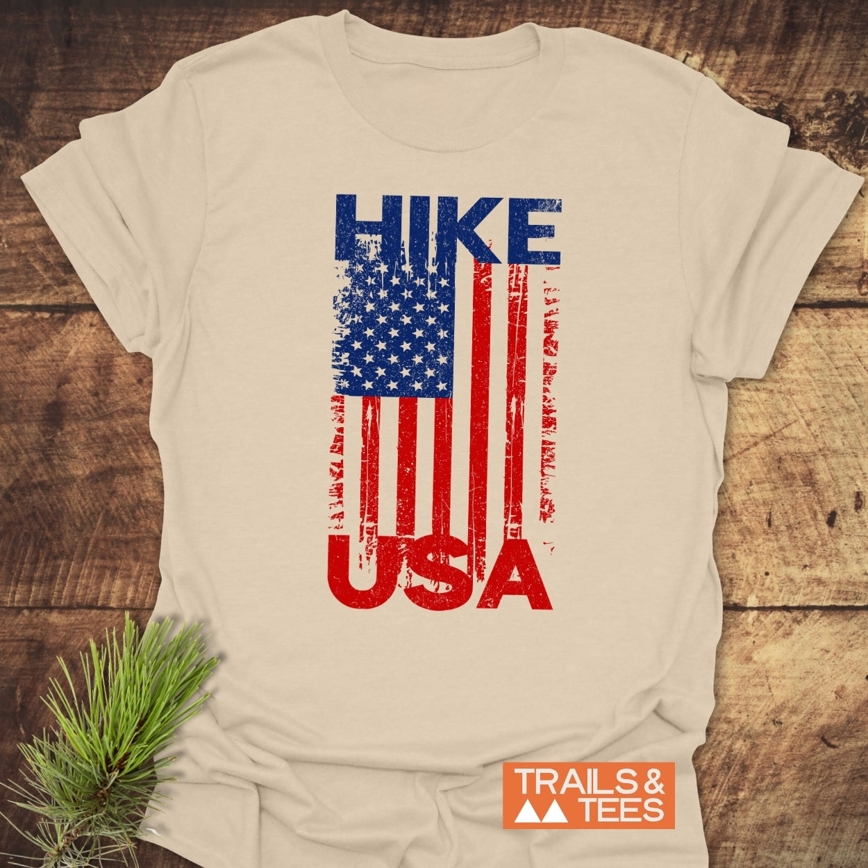 Hike USA T-Shirt featuring a distressed American flag graphic, perfect for outdoor adventures. Made from soft ring-spun cotton for comfort and durability.