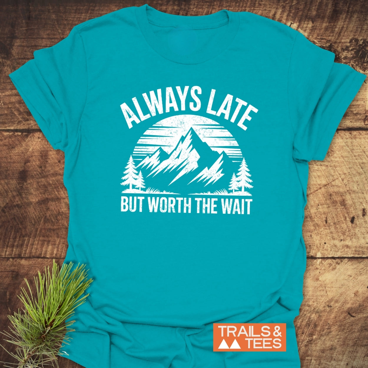 Always Later Funny T-Shirt featuring a distressed mountain graphic, slogan, and Trails & Tees logo, crafted from soft, lightweight cotton for everyday outdoor adventures.