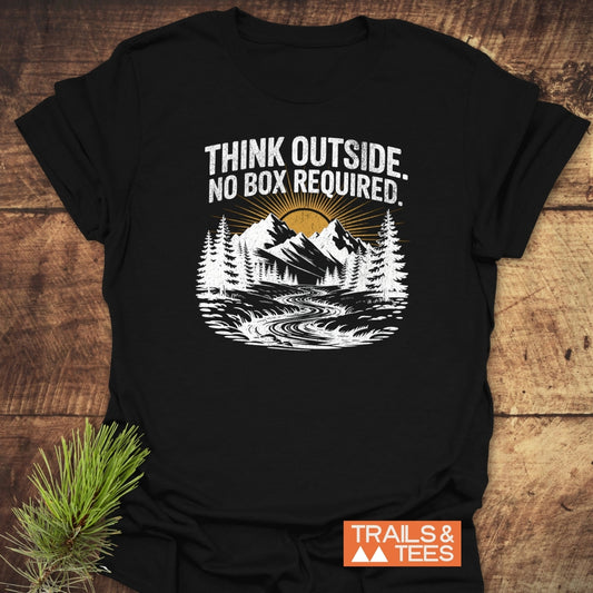 Think Outside T-Shirt with mountain graphic, slogan, and Trails & Tees logo on soft ring-spun cotton, emphasizing outdoor adventure and sustainable design.