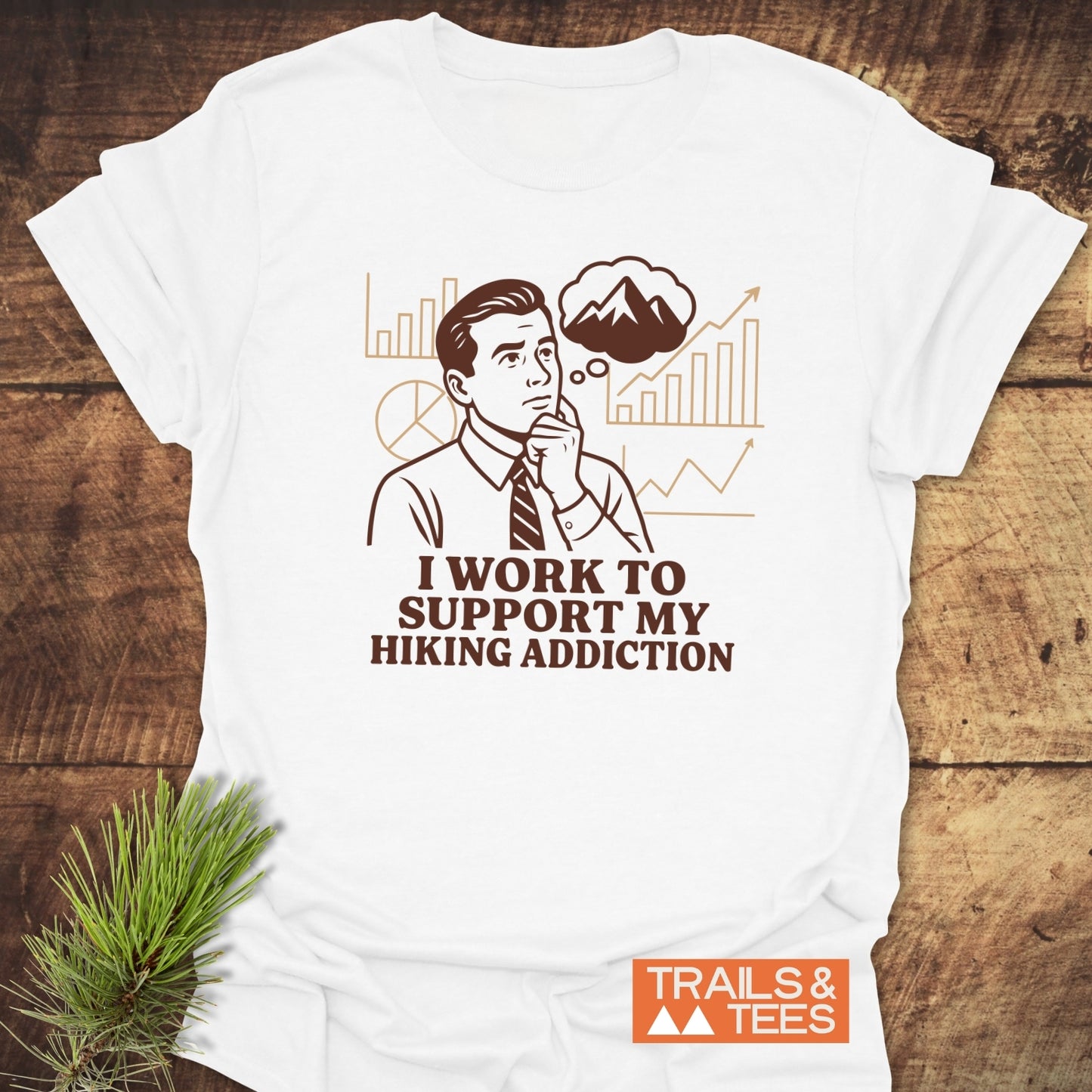 Hiking Addiction Funny T-Shirt featuring a retro office worker graphic with hiking theme, laid on rustic wood, highlighting comfort and durability from Trails & Tees.