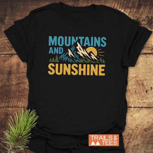 Mountains And Sunshine T-Shirt featuring a graphic of snow-capped mountains and sun, crafted from soft cotton for everyday outdoor adventures.