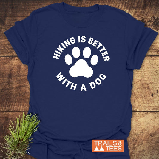 Hiking With Dogs T-Shirt features a white paw-print and slogan graphic, showcasing outdoor spirit, crafted from soft ring-spun cotton for comfort and durability.
