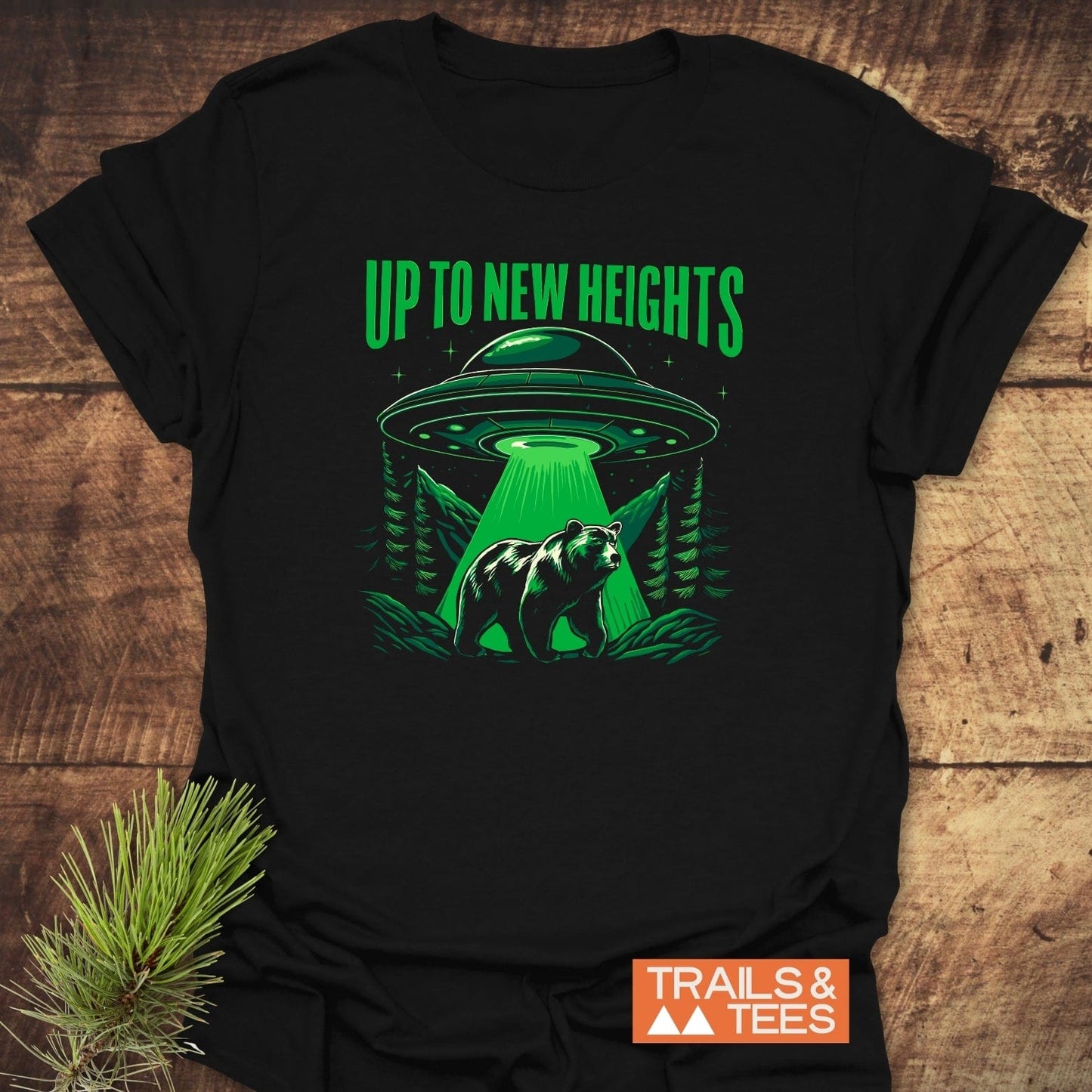 Up To New Heights Funny T-Shirt with UFO and bear design, crafted from soft cotton, ideal for outdoor enthusiasts. Features durable print and comfortable fit.