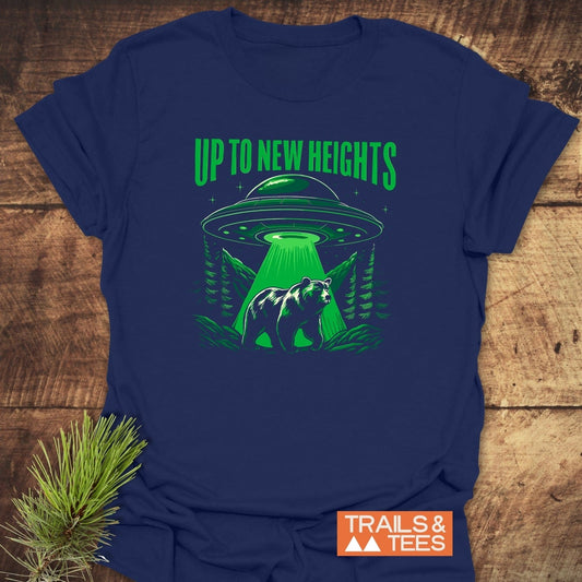 Up To New Heights Funny T-Shirt: Navy-blue tee with a UFO and bear graphic, showcasing adventure spirit. Made from soft, durable cotton for lasting comfort and fit.