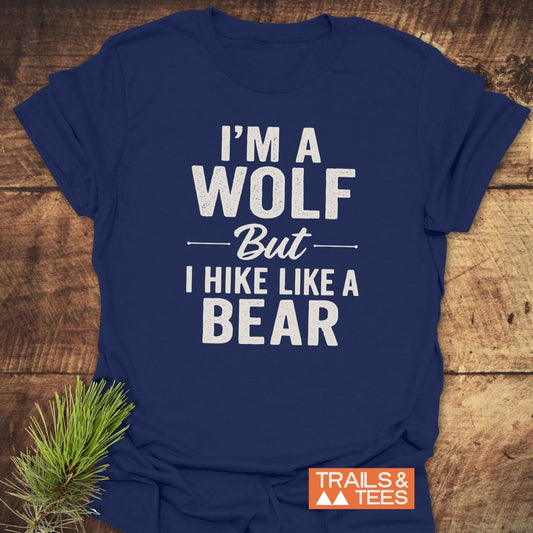 Navy I'm A Wolf Funny T-Shirt with bold white slogan, laid on wood surface, featuring Trails & Tees logo, showcasing outdoor-inspired, comfortable, durable design.