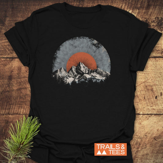 Rocky Mountains Sunset T-Shirt featuring a stylized mountain graphic on black fabric, showcasing outdoor-inspired design with durable prints and lightweight comfort.