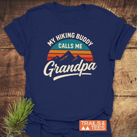 Grandpa Hiking Buddy T-Shirt with a retro mountain graphic and sunset, crafted from soft ring-spun cotton for comfort and durability, styled with pine sprig.