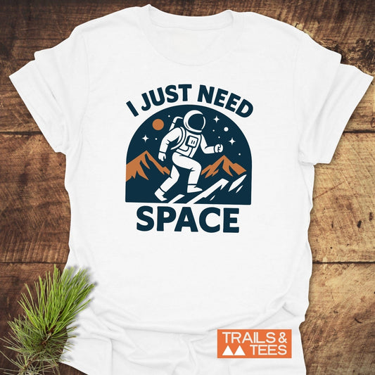 I Just Need Space T-Shirt: Astronaut graphic on white, ring-spun cotton tee, showcasing durability with DTF print and taped shoulders for outdoor adventures.
