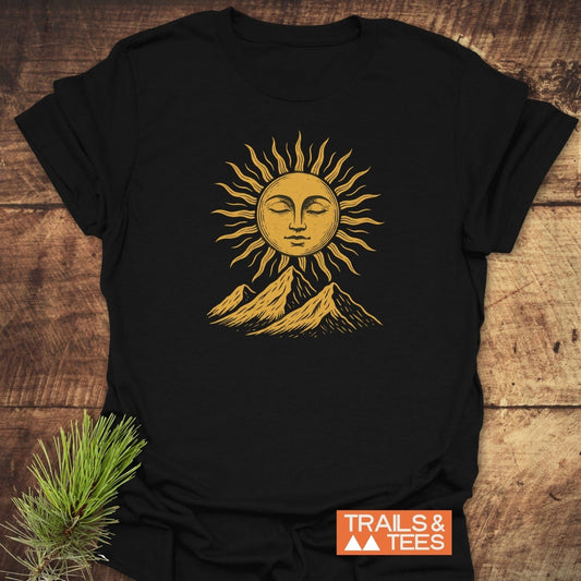 Sun And Mountains Boho T-Shirt with a golden sun and mountain design on black cotton, emphasizing durability and comfort for outdoor enthusiasts.