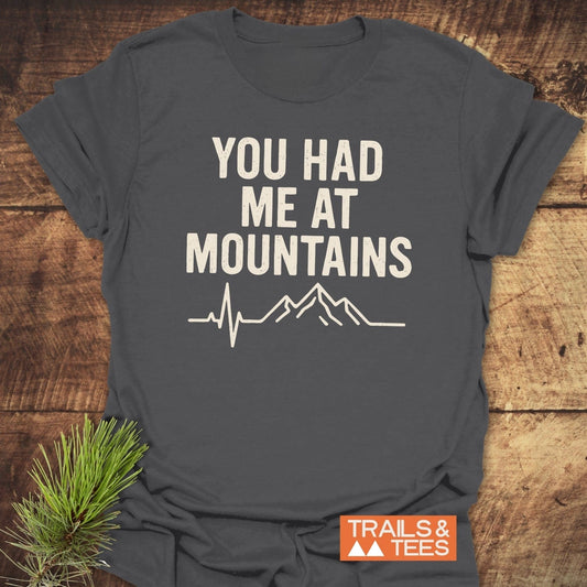 You Had Me At Mountains T-Shirt with ECG-style mountain graphic, charcoal crew-neck, soft ring-spun cotton, showcasing outdoor passion with durable print.