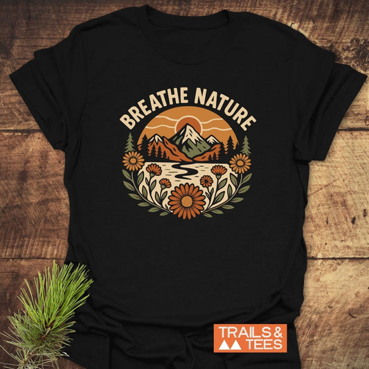 Breathe Nature T-Shirt featuring a retro mountain scene with BREATHE NATURE text, crafted from soft cotton, ideal for outdoor enthusiasts.