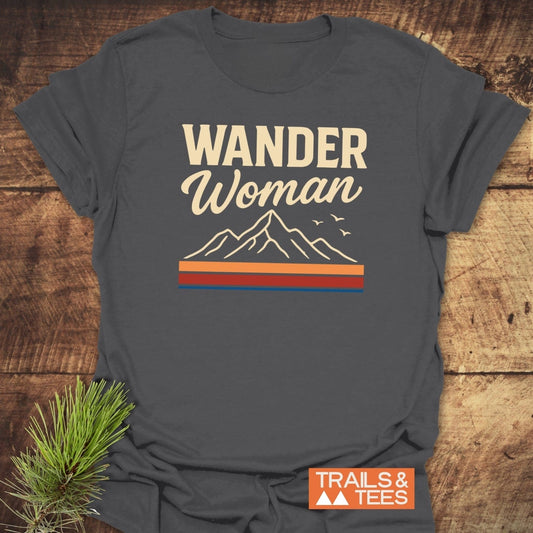 Wander Woman Graphic T-Shirt featuring mountain line-drawing and slogan, crafted from soft ring-spun cotton for comfort and durability, ideal for outdoor enthusiasts.