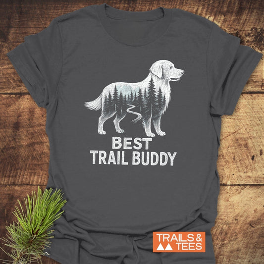 Best Trail Buddy Golden Retriever T-Shirt featuring a retriever with pine trees and trail illustration. Made from soft, ring-spun cotton, perfect for outdoor enthusiasts.