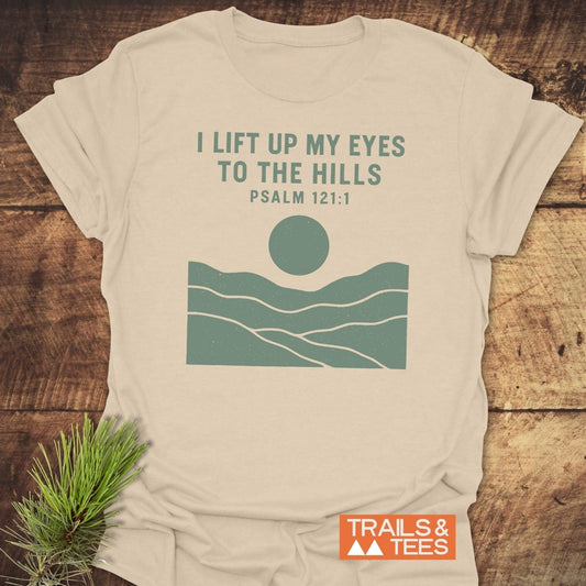 I Lift My Eyes... Mountain T-Shirt featuring a teal sun and hills graphic, Psalm 121:1 text, crafted from soft, lightweight cotton.