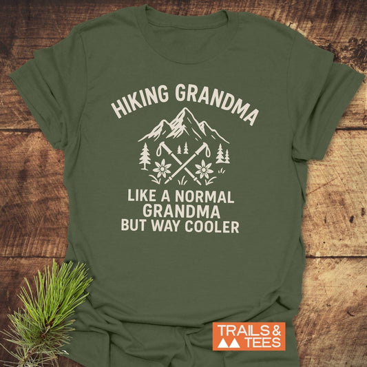Hiking Grandma Mountain T-Shirt with outdoorsy graphic and playful text, showcasing durable, pre-shrunk cotton and sustainable design from Trails & Tees.