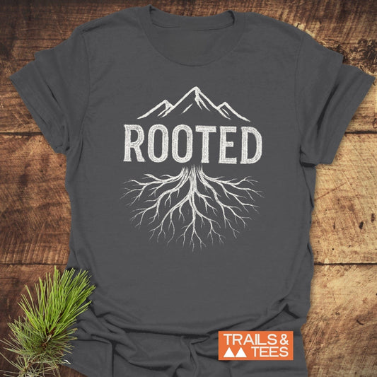 Rooted Mountain T-Shirt featuring a mountain and roots graphic on a charcoal-gray tee, ideal for outdoor enthusiasts, crafted from soft, durable cotton.
