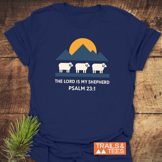 The Lord Is My Shepherd T-Shirt featuring white sheep and mountains graphic, crafted from lightweight cotton for comfort, with durable prints and a reliable fit.