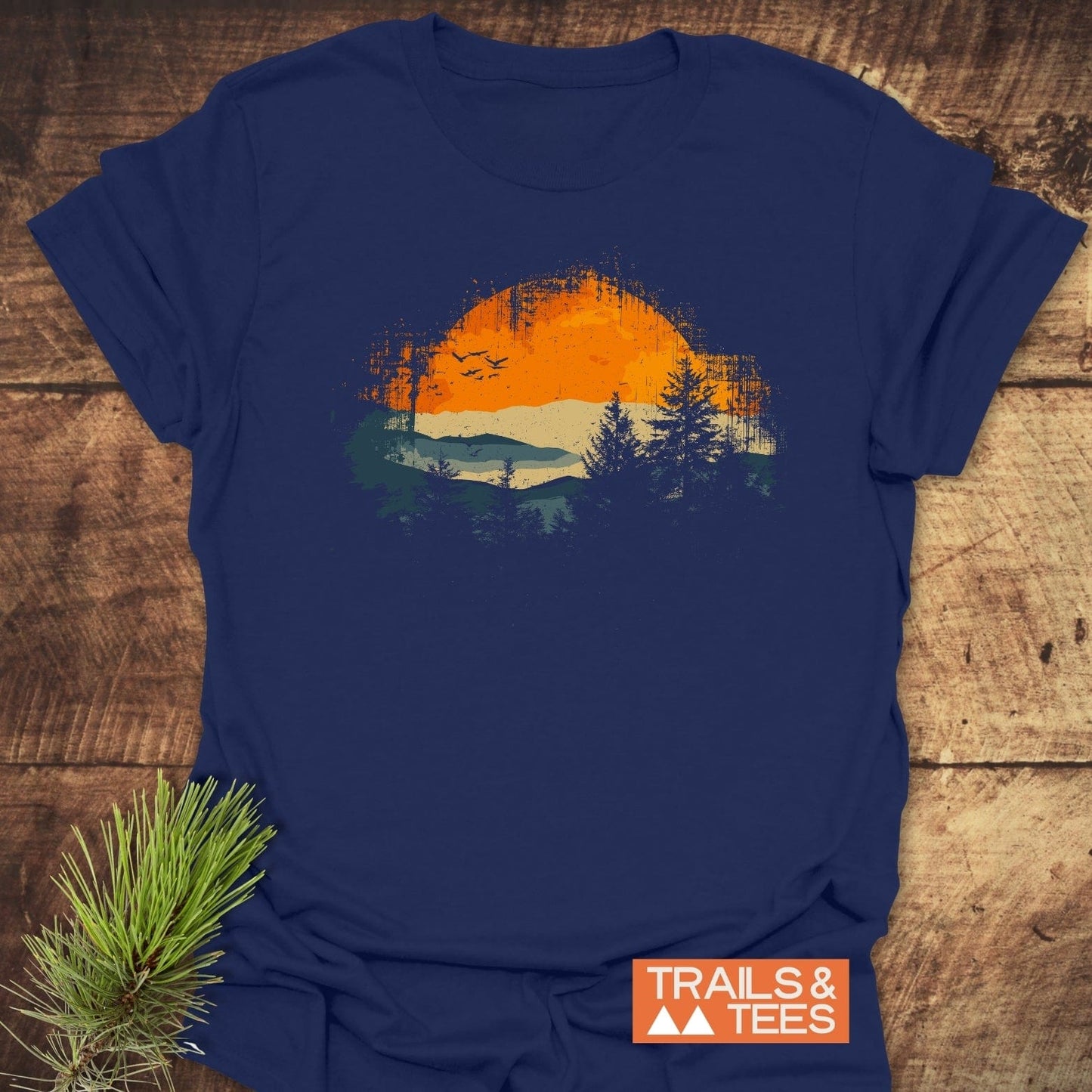 Great Smoky Mountains T-Shirt featuring a circular landscape graphic with an orange sun, hills, and trees, symbolizing outdoor adventures.