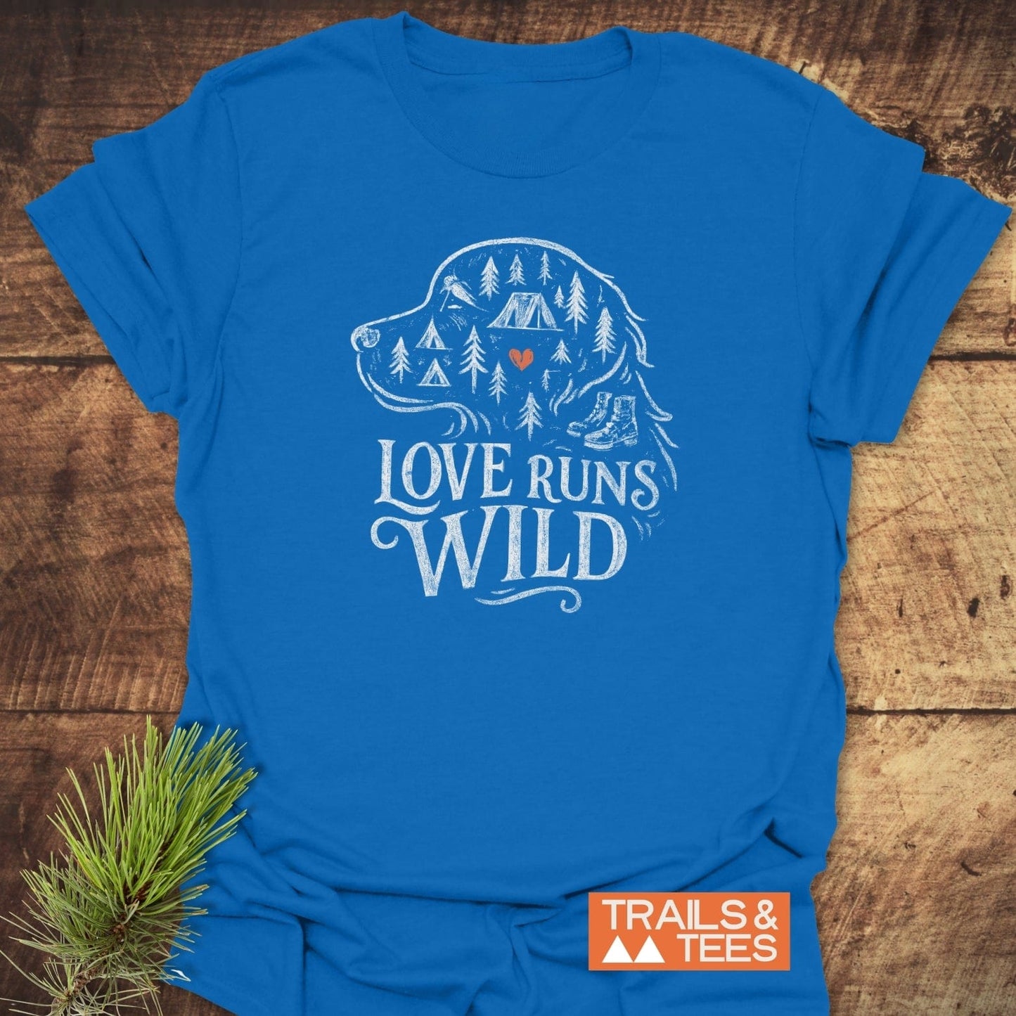 Love Runs Wild T-Shirt featuring a white dog profile with outdoor elements, slogan, and Trails & Tees logo; made from soft, lightweight cotton.