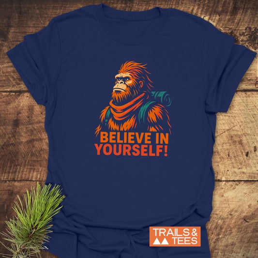 Believe In Yourself Bigfoot T-Shirt featuring a stylized illustration of a bearded hiker with a motivational slogan, crafted for comfort and durability.