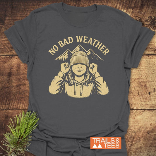 No Bad Weather T-Shirt featuring a cream graphic of a hooded figure with mountains, highlighting trail-tested comfort and durable design for outdoor enthusiasts.