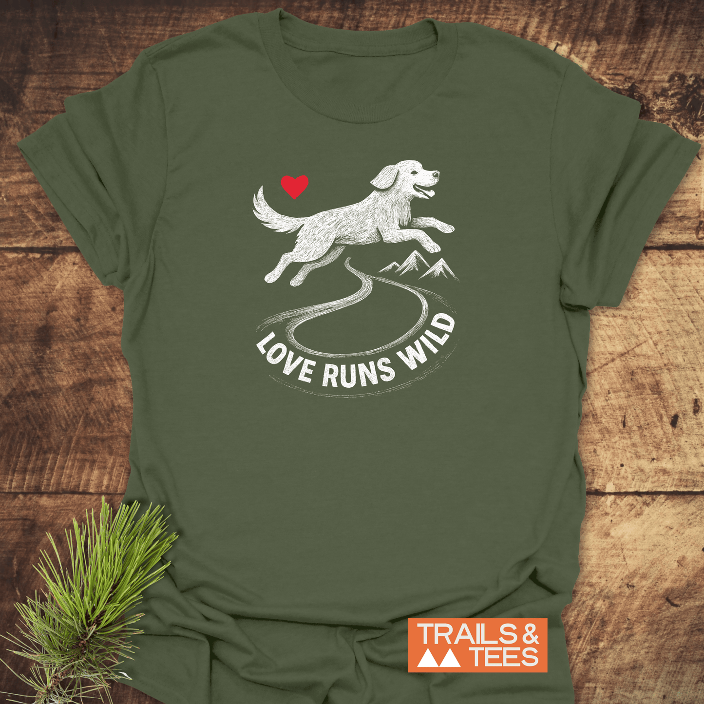 Love Runs Wild Doglover T-Shirt featuring a joyful dog sketch leaping over a trail toward mountains, accented with a heart, embodying outdoor adventure spirit.