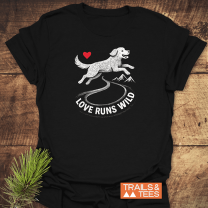 Wander Often T-Shirt featuring a happy running dog graphic and LOVE RUNS WILD slogan, laid on rustic wood, embodies adventure-ready comfort and sustainability.
