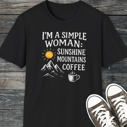 Simple Woman Sunshine T-Shirt featuring a sun, mountains, and coffee design, laid on wood with canvas sneakers. Perfect for outdoor enthusiasts seeking comfort and style.
