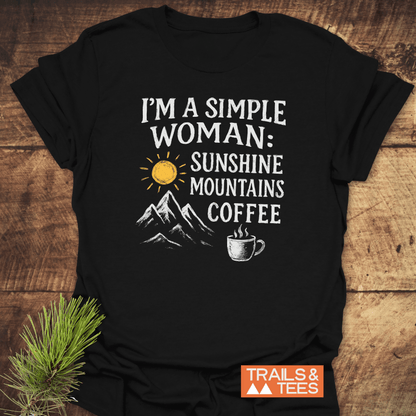 Simple Woman Sunshine T-Shirt featuring a sun, mountains, and coffee cup design, showcasing outdoor passion. Crafted from soft cotton with durable prints and a small Trails & Tees logo.