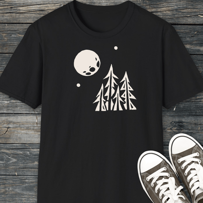 Black Pine Trees and Full Moon T-shirt with white graphic, laid flat. Accompanied by dark canvas sneakers, highlighting the shirt's outdoor-inspired design and comfort.