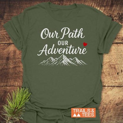 Our Path Couple T-Shirt features white text and mountain graphic, red heart accent, crafted from soft cotton for comfort, enhancing outdoor adventures with style.