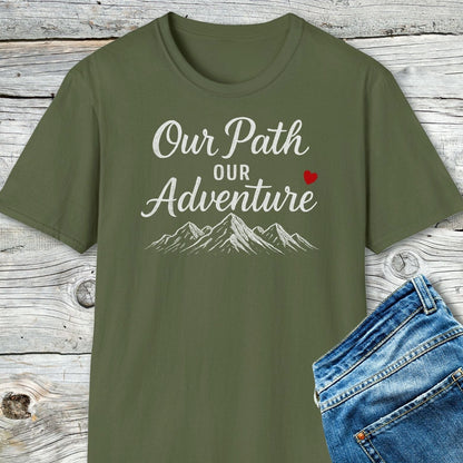 Olive-green Our Path Couple T-Shirt with mountain sketch and heart, displayed with blue jeans; crafted from soft cotton for outdoor comfort and durability.