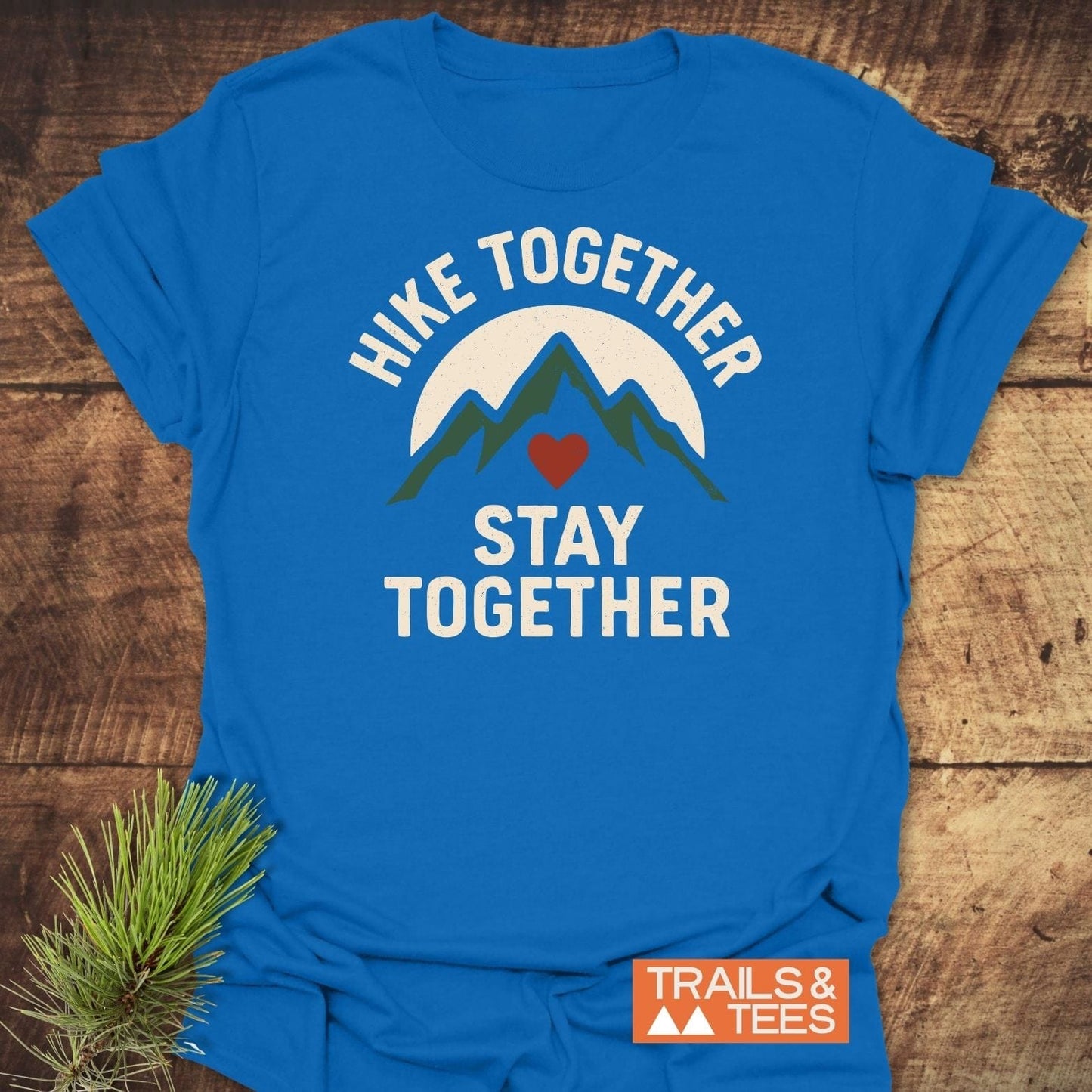 Hike Together Couple T-Shirt with mountain peaks graphic, sun, and heart. Soft, lightweight cotton, pre-shrunk, durable print, no side seams, ideal for outdoor enthusiasts.