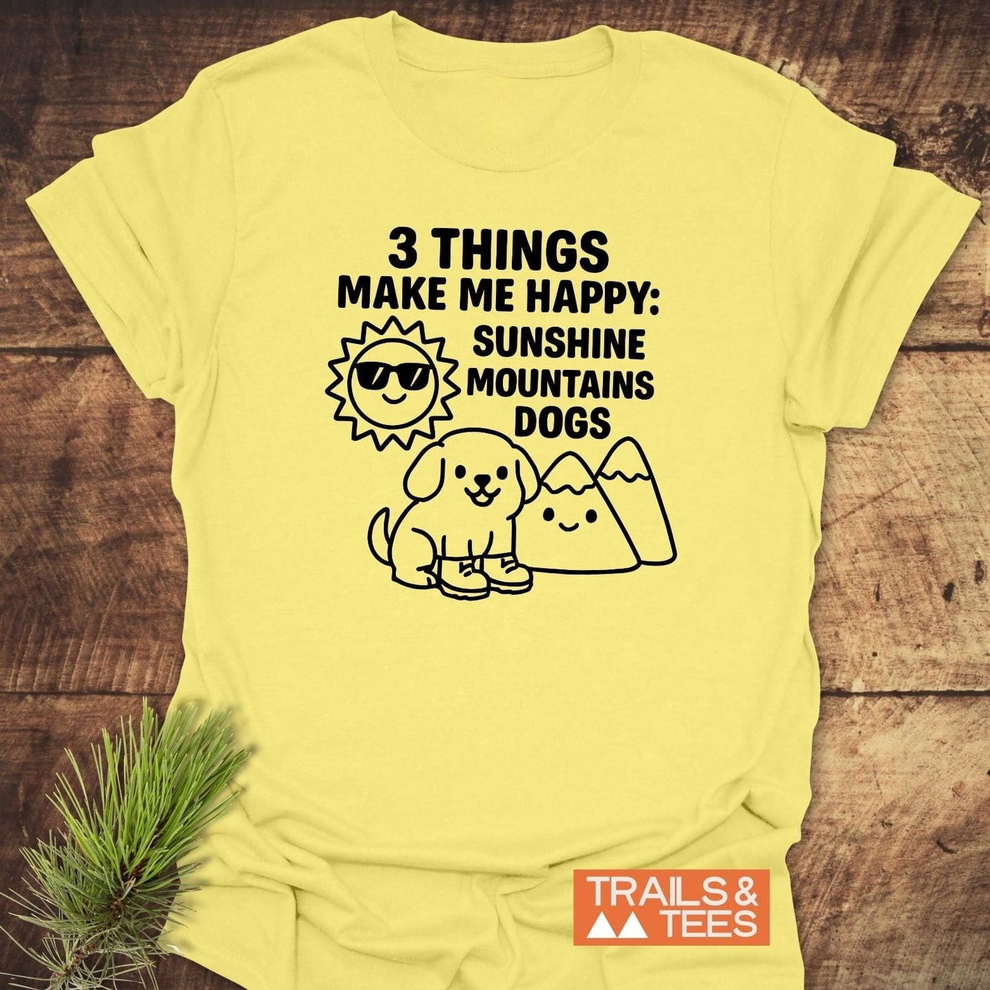 Sunshine Mountains Dogs T-Shirt with a graphic of sun, mountains, and dog. Soft, lightweight cotton, trail-tested comfort, durable prints.